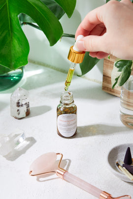 lose-up of amber glass bottle labeled Anti-Aging Youth Serum by Organics, featuring a white dropper and gold collar on a neutral background – ecobeaut.com, no chemicals, organic products