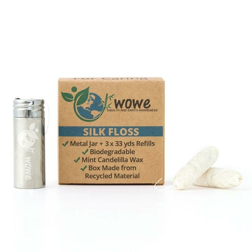 Wowe silk floss packaging with metal jar and floss on a white background
